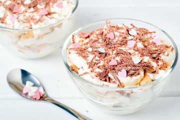 Cheesecake dessert in glass jar on wooden background. Healthy dessert. Healthy food concept.