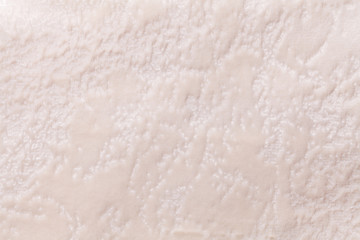 Pearl background from a soft upholstery textile material, closeup.