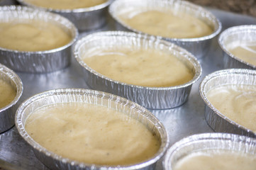 uncooking , making cakes, Close up uncooking cake on steel tray.