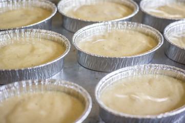 uncooking , making cakes, Close up uncooking cake on steel tray.