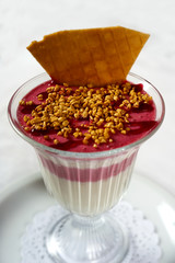 Fruit panna cotta with walnuts, isolated on white background.
