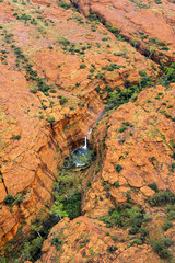 Kings Canyon Aerial View. View of famous Kings Canyon, Australia. Taken during a helicopter flight. Waterfall is visible in the center, there was heavy rain in the night.