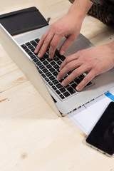 Fototapeta na wymiar Person Typing on a modern laptop in an office