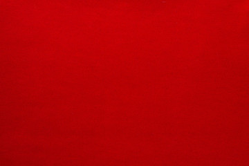 The texture of a knitted woolen fabric red