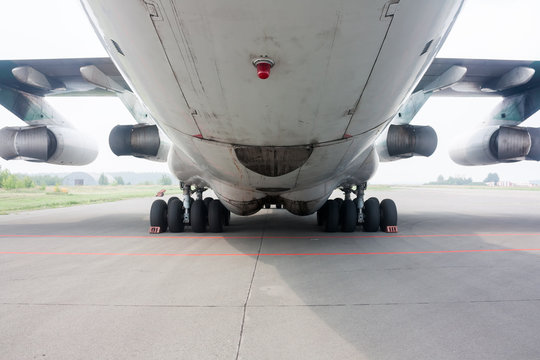 Rear view of main landing gear and cargo hatch of big wide body aircraft