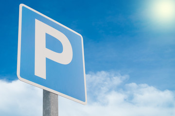 Parking sign on sky and cloud background.