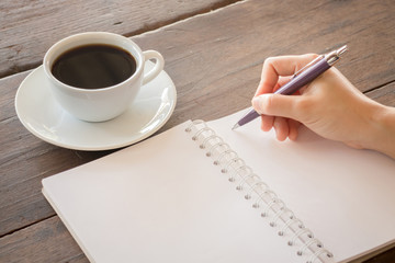 Hot cup of coffee on working table