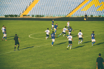 Football match in sunny summer day