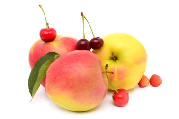 Apples with berries on a white background