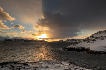 Fototapeta na wymiar Sunrise on the Barents Sea. Teriberka, Murmansk region, Russia