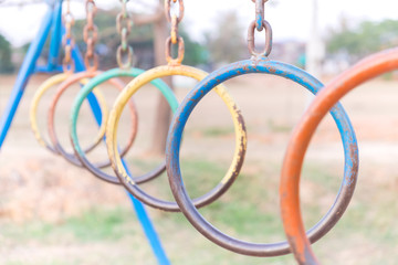 colorful old iron ring in playground at the school garden with b