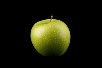 Green apple on black or isolated background