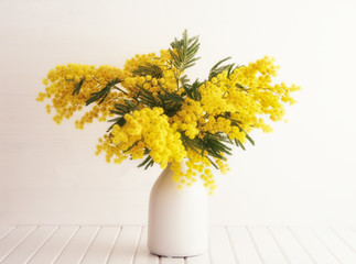 Vase with mimosa flowers