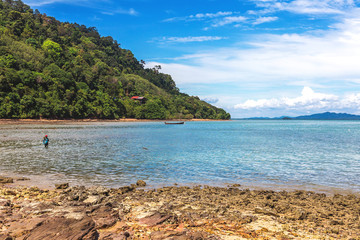 Naklejka premium Fishing village at low tide - ethnic buildings, Thailand.