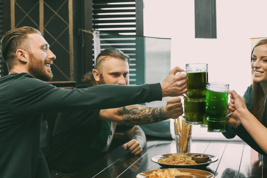 People celebrating Saint Patrick's Day in pub