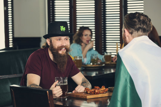 Men celebrating Saint Patrick's Day in pub
