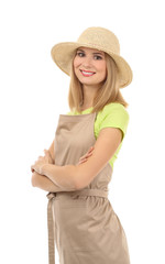 Beautiful woman in apron and straw hat isolated on white background