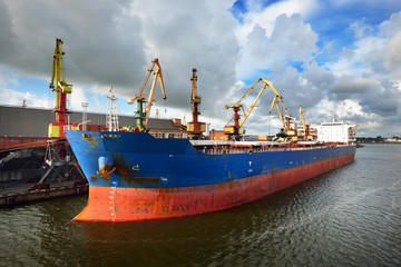 Large bulker ship loading coal in Ventspils free port