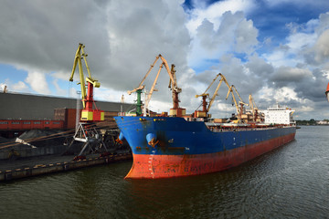 Large bulker ship loading coal in Ventspils free port