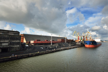 Large bulker ship loading coal in Ventspils free port