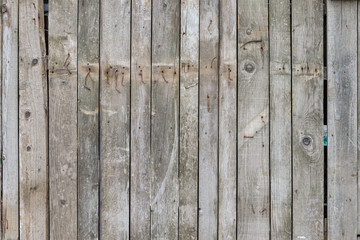 background texture. old wooden fence with rusty nails