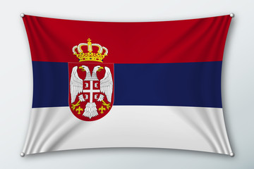 Serbia national flag. Symbol of the country on a stretched fabric with waves attached with pins. Realistic vector illustration.