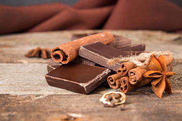 Stack of chocolate cracked pieces with cinnamon, anise star