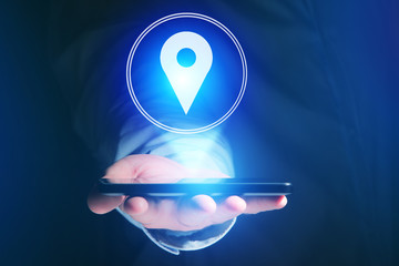 Vuiew of a Concept of geographical localization on a map with a smartphone