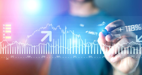 Man writing Trading data information on a technology futuristic