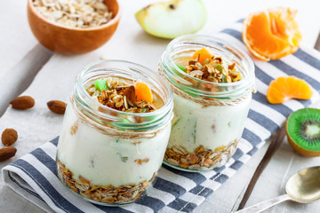Healthy meal made of granola, yogurt and fruits. Delicious food for breakfast. Traditional American snack.