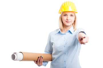 Woman architect holding blueprints and pointing