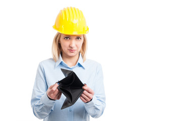 Female architect wearing helmet showing empty wallet