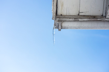 ice icicles on the roofs of houses