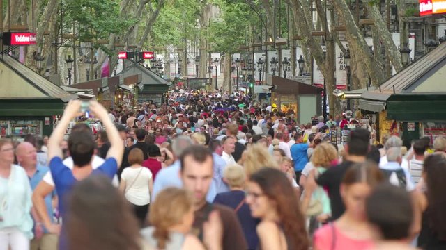 Crowded Les Rambles Boulevard in Downtown Barcelona.
Tourists crowd in Barcelona Time Lapse.
Crowds of tourists in Barcelona.
Tourists walking in Barcelona in Summer.
Crowded Les Rambles.
