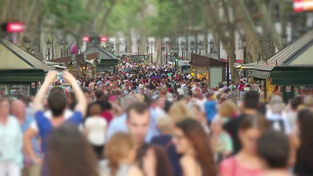 Crowded Les Rambles Boulevard in Downtown Barcelona Blurred.
Tourists crowd in Barcelona Time Lapse.
Crowds of tourists in Barcelona.
Tourists walking in Barcelona in Summer.
