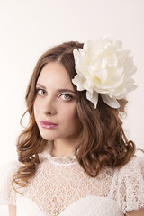 Naklejka premium girl in white dress and with white flower in her hair