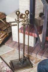 set of tools for cleaning fireplace, standing on floor