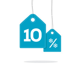 Obraz na płótnie Canvas Blue hanging price tag labels with 10% and snowflake percent design texts on them and with shadow isolated on white background. For winter sale campaigns.