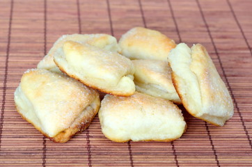 Homemade cheese biscuits topped with sugar on bamboo napkin
