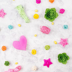 Beautiful  background  with Spring decorations: gifts, green succulents, heart, ribbons and rattan balls. Copy space