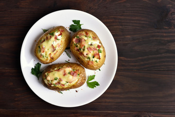 Homemade potato skins with bacon, cheese and green onion, top vi