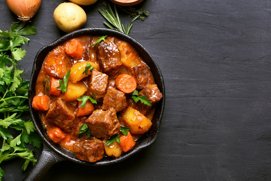 Beef stew with potatoes, carrots and herbs