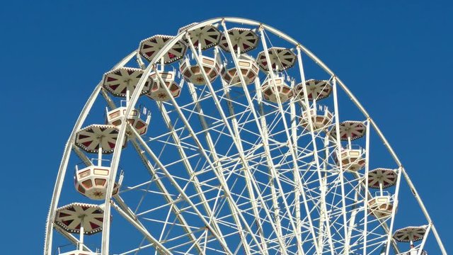Tall Classical Fair Ferris Wheel In France.
Ferris wheel on the banks of the Garonne River in Toulouse, France.
Fair Ferris Wheel spinning at sunset.
Fairground in France.
