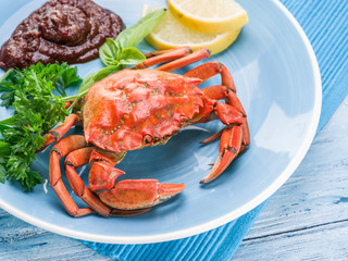 Cooked crab with lemon and herbs.