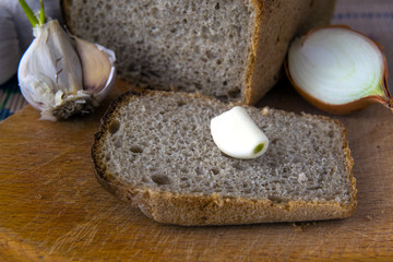 Garlic, onion , bread on the table