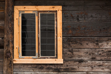 Fototapeta na wymiar The wooden window in an old house