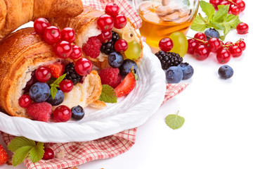 Fresh croissants and honey.