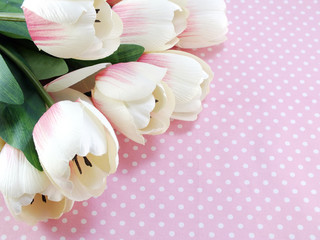 bouquet of  tulip artificial flower on pink background space for text