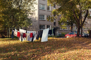 Freshly washed loundry is hanging in the clothesline