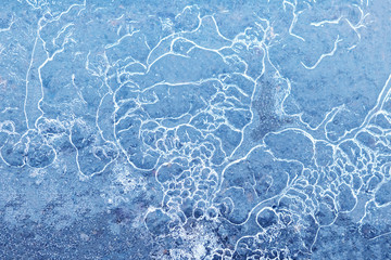 Asphalt road covered with ice, background. Toned